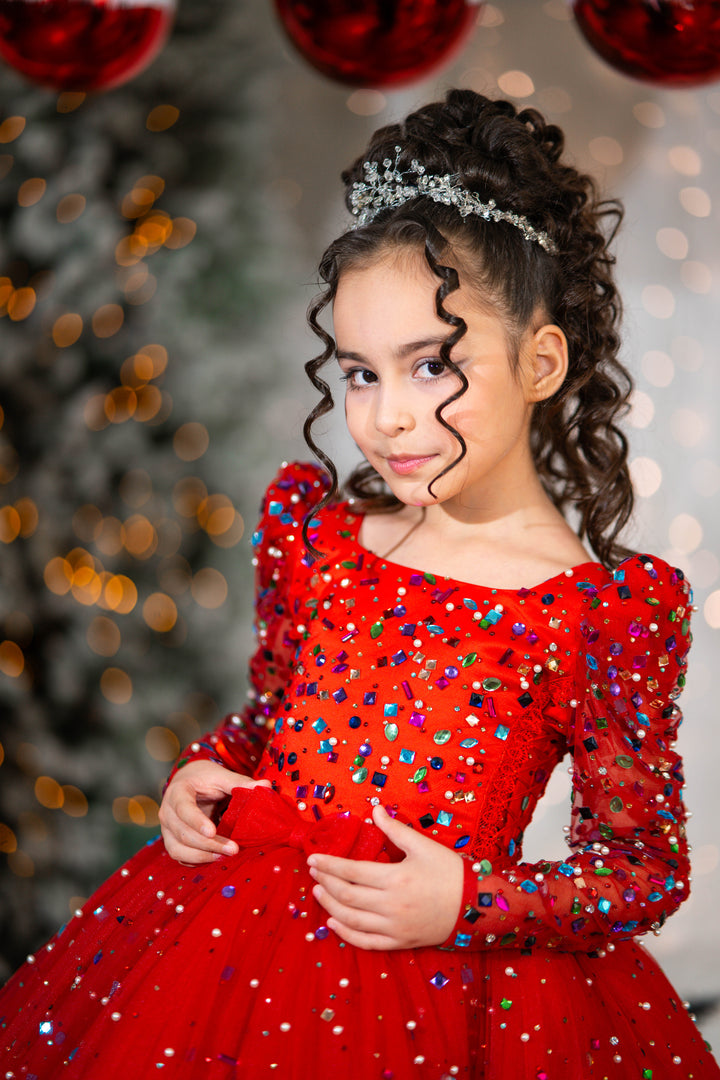 Young girl in a red dress with colorful sequins against a festive background